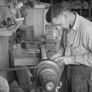 historical image of man working in factory