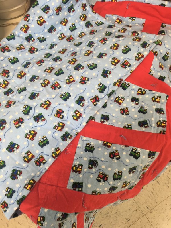 Baby quilt with train design