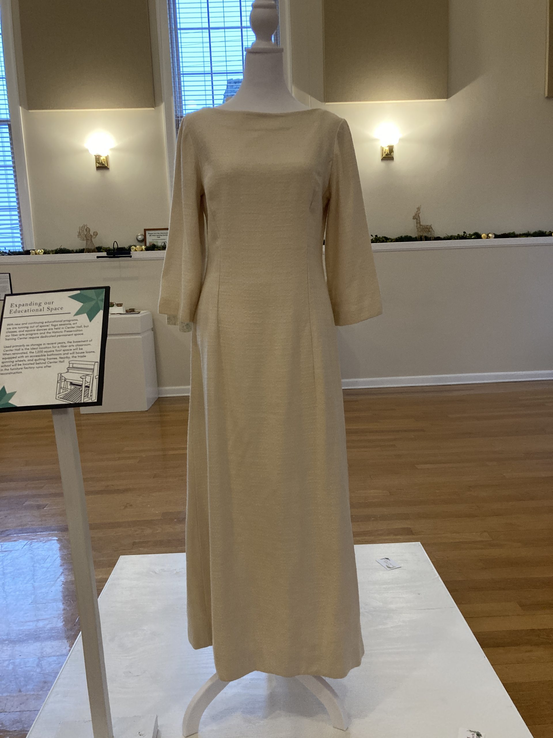 Wedding Dress
Barbra Dorothy Mayor Thompson
1968

Master weaver and homesteader descendant Barbra “Dorothy” Mayor Thompson created this wedding dress for her daughter Sarah in 1968. Using a summer-winter weave, Thompson wove the fabric then cut pieces from a pattern, finally sewing the entire dress together. Even the buttons on the back are covered with woven material.

On loan from Sarah Thompson Fletcher
2022.30L.01